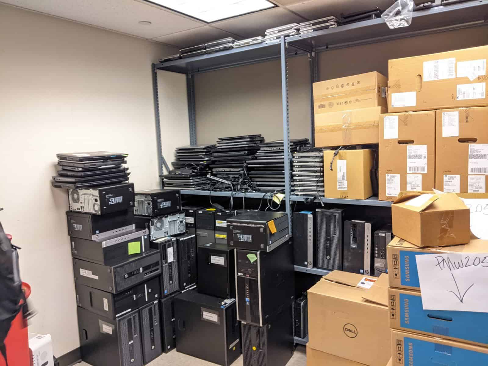 A room full of computer equipment and boxes.